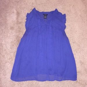 Size M. Blue blouse with shoulder ruffles.